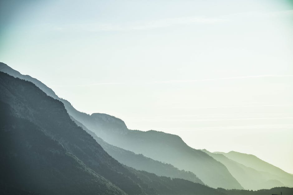 lake reflections a serene view of misty mountain layers in schwaz #1054222 Lake Reflections - A serene view of misty mountain layers in Schwaz #1054222
