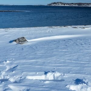 Snow Mountains - Serene winter scene of a snow-covered shoreline #11138875