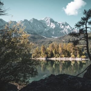 Mountain Landscapes - Breathtaking view of Zugspitze and Eibsee reflec #12568085