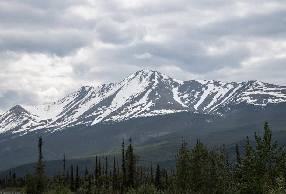 snow mountains snow capped mountain under cloudy sky in alberta #12597229 Snow Mountains - Snow-capped mountain under cloudy sky in Alberta #12597229