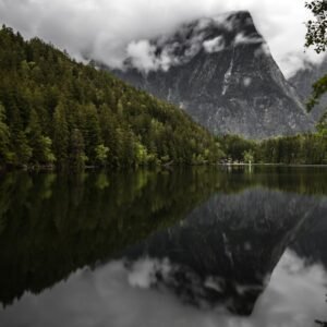 Lake Reflections - A breathtaking view of Lake Plansee with mountai #12627128