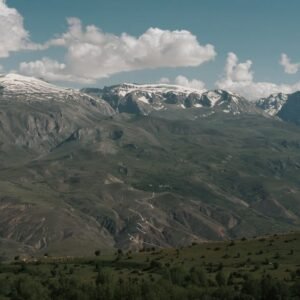 Snow Mountains - Scenic view of a vast mountain range featuring s #18864605