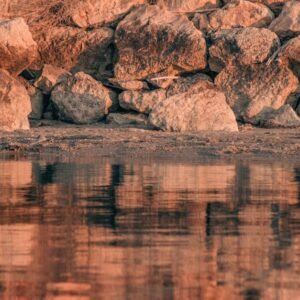 Beach Scenery - Tranquil reflection of rocky shoreline at Urla, #19887119