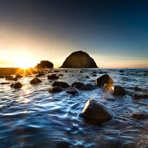 Beach Scenery - Peaceful sunrise over a rocky shoreline with cal #2163074