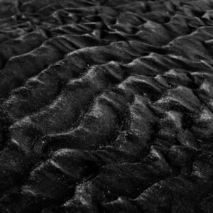 Desert Wilderness - Close-up of textured black sand dunes in monochr #2387818