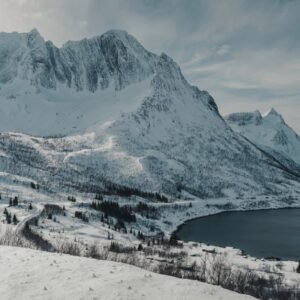 Snow Mountains - Snowy mountains over a serene fjord in the Norwe #29304901