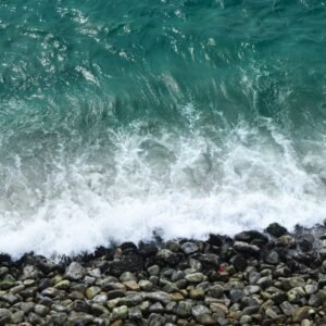 Beach Scenery - Aerial view of turquoise waves crashing on rocks #29520173