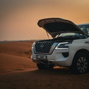 Desert Wilderness - A white SUV with an open hood parked on scenic d #30306611