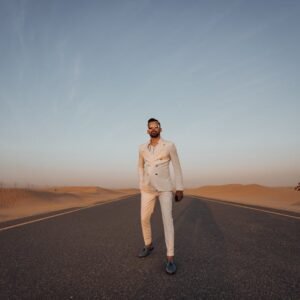 Desert Wilderness - Elegant man in formal wear standing on a desert  #3307832