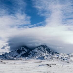 Snow Mountains - Majestic snow-covered mountains beneath a dramat #3555762