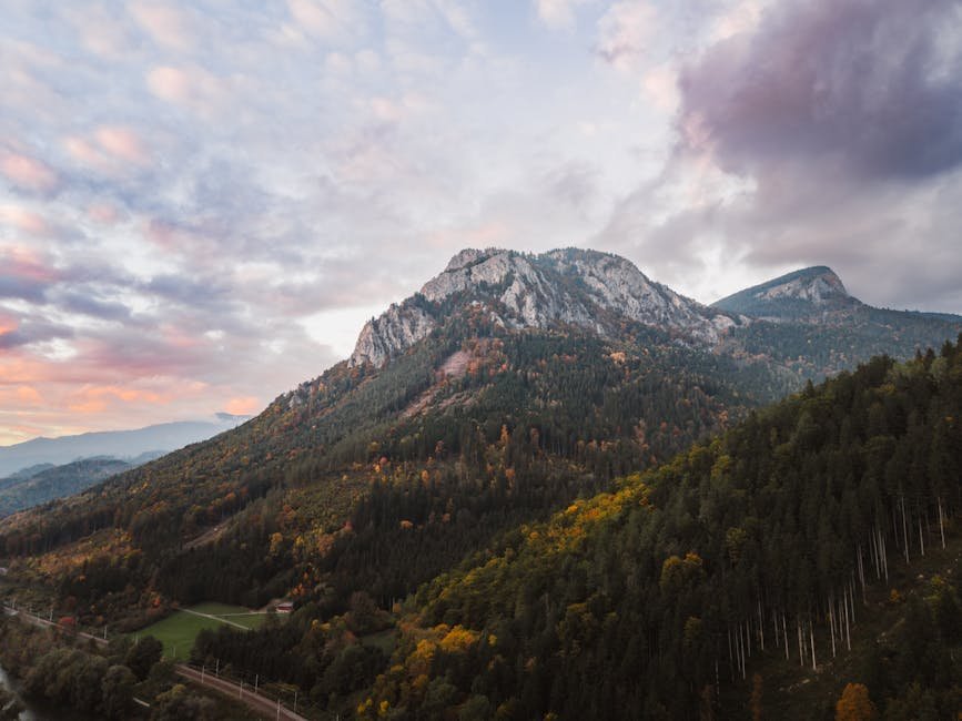 mountain landscapes a breathtaking view of a mountain peak surrounde #35674498 Mountain Landscapes - A breathtaking view of a mountain peak surrounde #35674498