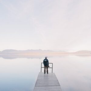 Forest Nature - A solitary traveler stands on a dock enjoying th #571169