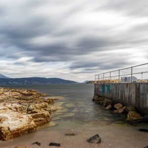 Beach Scenery - Peaceful coastal view of a rocky shoreline under #6571842