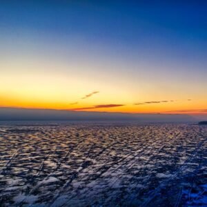 Lake Reflections - A breathtaking aerial view of a frozen lake at s #7929568
